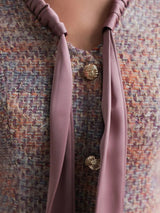 xylia bow v-neck long sleeve mini dress in multicolor