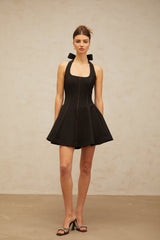 sandy halterneck bow-embellished mini dress in Black