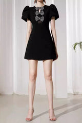 vanessa bow puff sleeve mini dress in black
