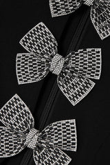 vanessa bow puff sleeve mini dress in black