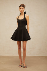 sandy halterneck bow-embellished mini dress in Black