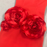 red strapless maxi dress with flower embellishments