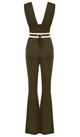 Open-back top and high-waisted bootcut trousers.